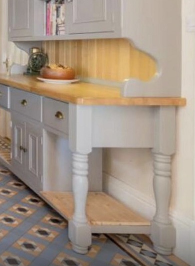 Old kitchen dresser unit with patterned floor